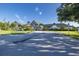 Community clubhouse with landscaping and driveway at 1153 Dustan Pl, Trinity, FL 34655