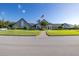 Community clubhouse with manicured lawn and flag at 1153 Dustan Pl, Trinity, FL 34655