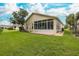 House exterior showcasing sunroom and backyard at 1153 Dustan Pl, Trinity, FL 34655