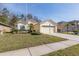 Tan one-story house with a two-car garage and manicured lawn at 1153 Dustan Pl, Trinity, FL 34655