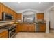 Spacious kitchen featuring granite countertops and stainless steel appliances at 1153 Dustan Pl, Trinity, FL 34655