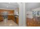 Kitchen with stainless steel appliances and wood cabinets at 1153 Dustan Pl, Trinity, FL 34655