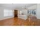 Living room with hardwood floors, large windows, and access to a sunroom at 1153 Dustan Pl, Trinity, FL 34655