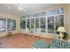 Sunroom with tiled floor, wicker furniture, and large windows at 1153 Dustan Pl, Trinity, FL 34655