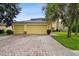 Two-story house with a three-car garage and a well-manicured lawn at 1545 Regal Mist Loop, Trinity, FL 34655