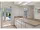Bathroom with vanity, toilet, and view of pool at 9410 Fox Hollow Ln, Weeki Wachee, FL 34613