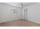 Spacious bedroom with neutral walls and carpet at 9410 Fox Hollow Ln, Weeki Wachee, FL 34613