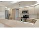 Kitchen boasts stainless steel appliances and a breakfast bar at 9410 Fox Hollow Ln, Weeki Wachee, FL 34613