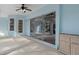 Outdoor patio with sliding glass doors and ceiling fan at 9410 Fox Hollow Ln, Weeki Wachee, FL 34613