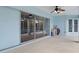 Screened patio with sliding glass doors and pool view at 9410 Fox Hollow Ln, Weeki Wachee, FL 34613