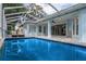 Refreshing pool with a view of the house at 9410 Fox Hollow Ln, Weeki Wachee, FL 34613