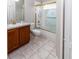 Bathroom featuring a vanity sink and tiled shower and bath at 2529 Sandy Hill Ct, Holiday, FL 34691