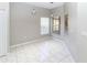 Cozy dining area with tile floors, modern pendant lights and multiple windows providing natural light at 2529 Sandy Hill Ct, Holiday, FL 34691