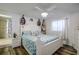 Nautical-themed bedroom featuring a queen bed, decorative boats, and an en suite bathroom at 3178 Sea Grape Dr, Hernando Beach, FL 34607