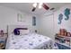Relaxing bedroom with a soft bed, nautical decor, and a ceiling fan at 3178 Sea Grape Dr, Hernando Beach, FL 34607