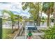 A boat ramp with a dock and railing near the water at 3178 Sea Grape Dr, Hernando Beach, FL 34607