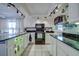 Bright kitchen features modern appliances, granite countertops, and ample cabinet space at 3178 Sea Grape Dr, Hernando Beach, FL 34607