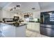 Well-lit kitchen with granite countertops, stainless steel appliances, and ample storage space at 3178 Sea Grape Dr, Hernando Beach, FL 34607