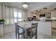 Charming kitchen with a dining table and a view of the countertops and cabinets at 3178 Sea Grape Dr, Hernando Beach, FL 34607