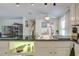 Close up view of a kitchen with granite countertops and bright modern dining area, filled with light at 3178 Sea Grape Dr, Hernando Beach, FL 34607