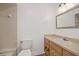 Clean bathroom with light beige tile and wood vanity at 4321 Tahitian Gardens Cir # A, Holiday, FL 34691