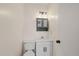 Simple bathroom with a toilet and pedestal sink at 4321 Tahitian Gardens Cir # A, Holiday, FL 34691