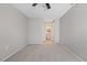 Spacious bedroom with carpet flooring and ceiling fan at 4321 Tahitian Gardens Cir # A, Holiday, FL 34691