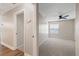 Second bedroom with carpet, window, and ceiling fan at 4321 Tahitian Gardens Cir # A, Holiday, FL 34691