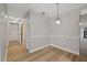 Bright dining area with light gray walls and wood-look flooring at 4321 Tahitian Gardens Cir # A, Holiday, FL 34691