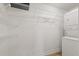 Laundry closet with shelving and stackable washer/dryer at 4321 Tahitian Gardens Cir # A, Holiday, FL 34691
