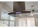 Contemporary range hood with digital controls above the stove at 4321 Tahitian Gardens Cir # A, Holiday, FL 34691