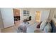 Comfortable bedroom with neutral tones, wood flooring, and ensuite bathroom at 3605 Kings Rd # 102, Palm Harbor, FL 34685