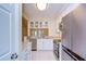 Bright kitchen featuring white cabinets, stainless steel appliances, and granite countertops at 3605 Kings Rd # 102, Palm Harbor, FL 34685