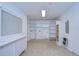 Bright laundry room featuring a large countertop, storage cabinets, and tile flooring at 3605 Kings Rd # 102, Palm Harbor, FL 34685