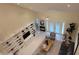 Open living room with a large entertainment center, high ceilings, and sliding glass doors at 3605 Kings Rd # 102, Palm Harbor, FL 34685