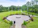 Circular community park with benches and flagpoles at 4056 Southern Valley Loop, Brooksville, FL 34601