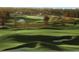 Picturesque golf course featuring rolling greens, sand traps, and manicured fairways at 19395 Sheltered Hill Dr, Brooksville, FL 34601