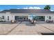 Poolside bar with outdoor seating on a paved patio, perfect for enjoying drinks and socializing at 19395 Sheltered Hill Dr, Brooksville, FL 34601