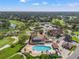 Aerial view of community features including pool, clubhouse, and golf course at 2421 Rolling View Dr, Spring Hill, FL 34606