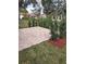 Neatly landscaped patio with brick pavers at 2421 Rolling View Dr, Spring Hill, FL 34606