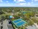 Aerial view of tennis courts within a community at 2421 Rolling View Dr, Spring Hill, FL 34606