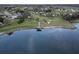 Aerial view of community lake and surrounding homes at 13447 Newport Shores Dr, Hudson, FL 34669