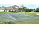 Community basketball court with markings and nearby clubhouse at 13447 Newport Shores Dr, Hudson, FL 34669