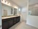 Modern bathroom with double vanity and shower at 13447 Newport Shores Dr, Hudson, FL 34669