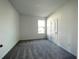 Spacious bedroom with grey carpet and neutral walls at 13447 Newport Shores Dr, Hudson, FL 34669