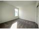 Well-lit bedroom with grey carpet and closet at 13447 Newport Shores Dr, Hudson, FL 34669