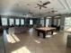 Bright clubhouse with seating and pool table at 13447 Newport Shores Dr, Hudson, FL 34669