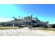 Community clubhouse with parking lot at 13447 Newport Shores Dr, Hudson, FL 34669