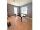 Bright dining room with large table and gray walls at 13447 Newport Shores Dr, Hudson, FL 34669