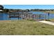 Community dock offering scenic lake views at 13447 Newport Shores Dr, Hudson, FL 34669